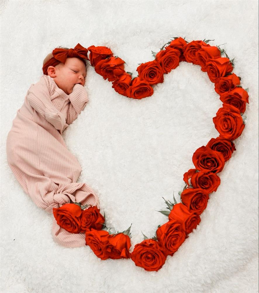 created heart shape and on right while connecting both edge baby is sleeping